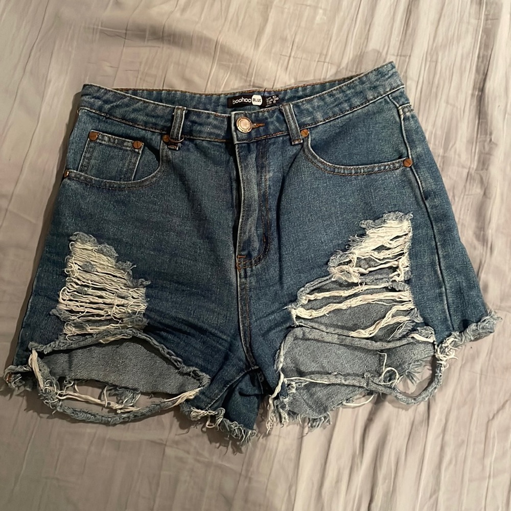 Size 6, Blue, High-waisted, Ripped Jean Shorts from Boohoo.